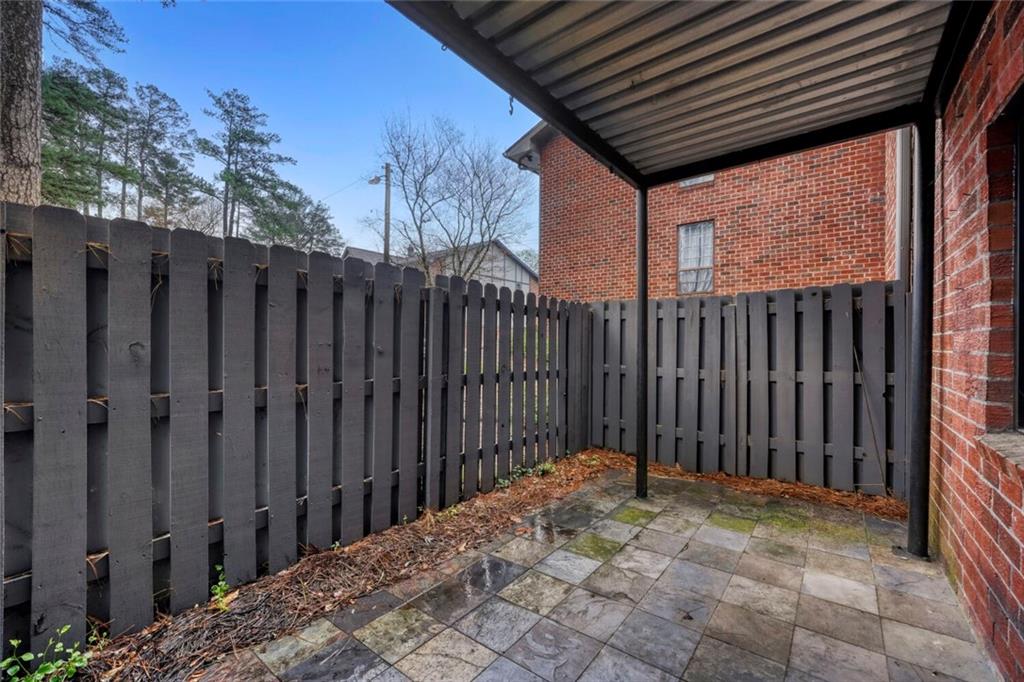 6851 Roswell Road, Unit M13 Atlanta, GA 30328 - Photo 16 of 28 a view of a backyard of the house