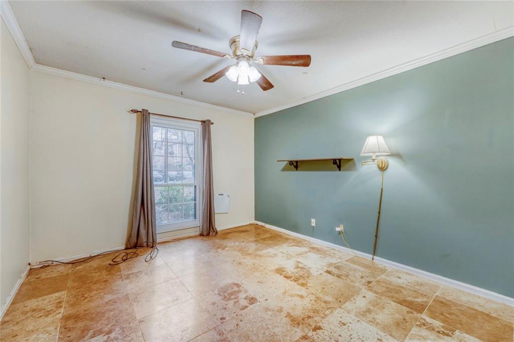 6851 Roswell Road, Unit M13 Atlanta, GA 30328 - Photo 17 of 28 a view of a room with a ceiling fan and window