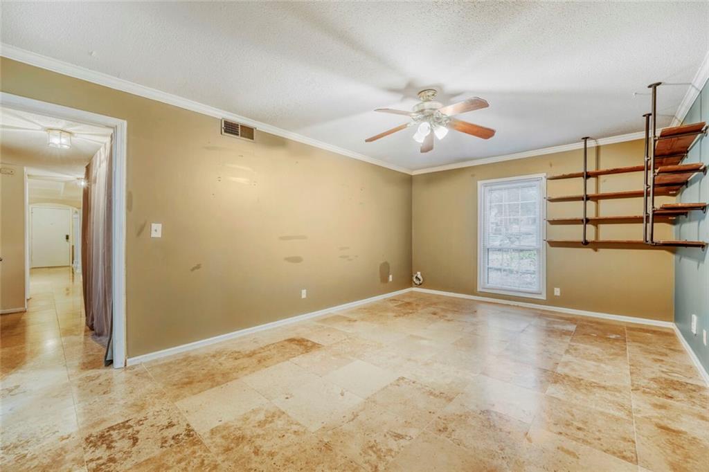 6851 Roswell Road, Unit M13 Atlanta, GA 30328 - Photo 19 of 28 an empty room with closet and a chandelier fan