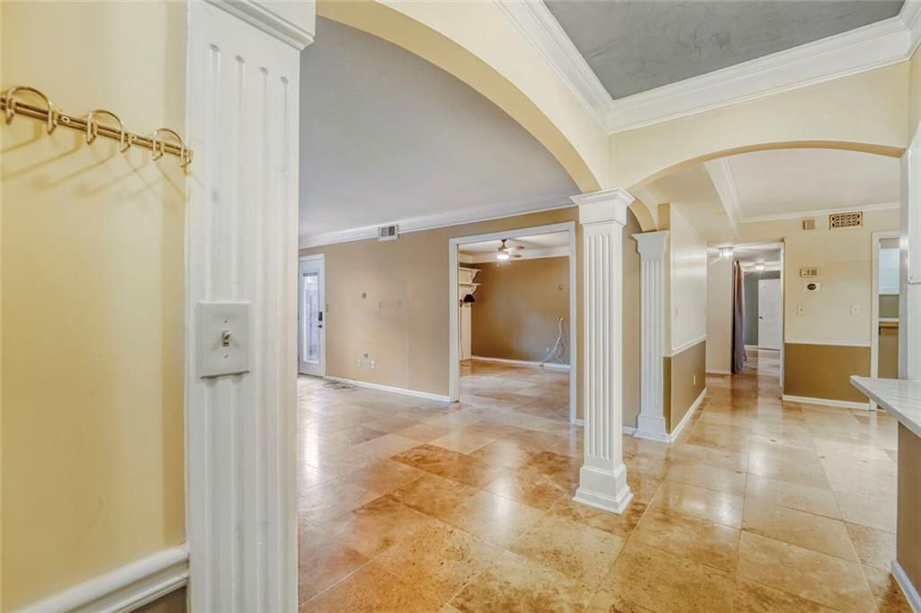 6851 Roswell Road, Unit M13 Atlanta, GA 30328 - Photo 2 of 28 a view of a hallway with wooden shelves