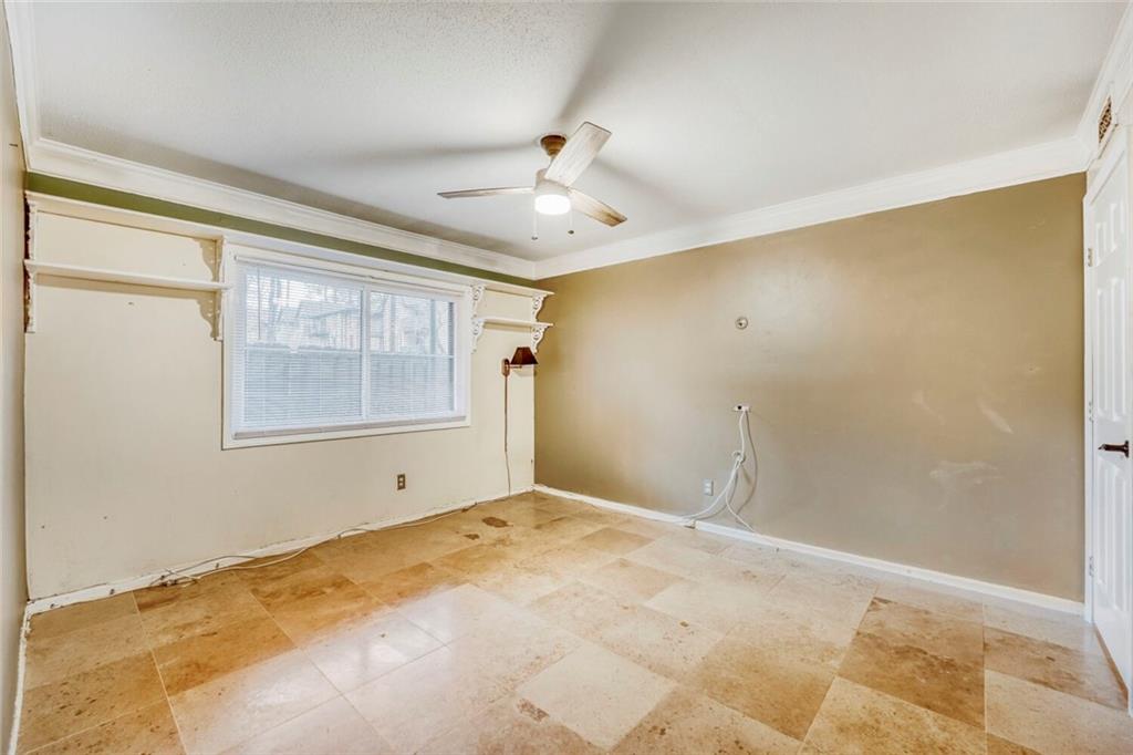 6851 Roswell Road, Unit M13 Atlanta, GA 30328 - Photo 6 of 28 a view of an empty room with a window