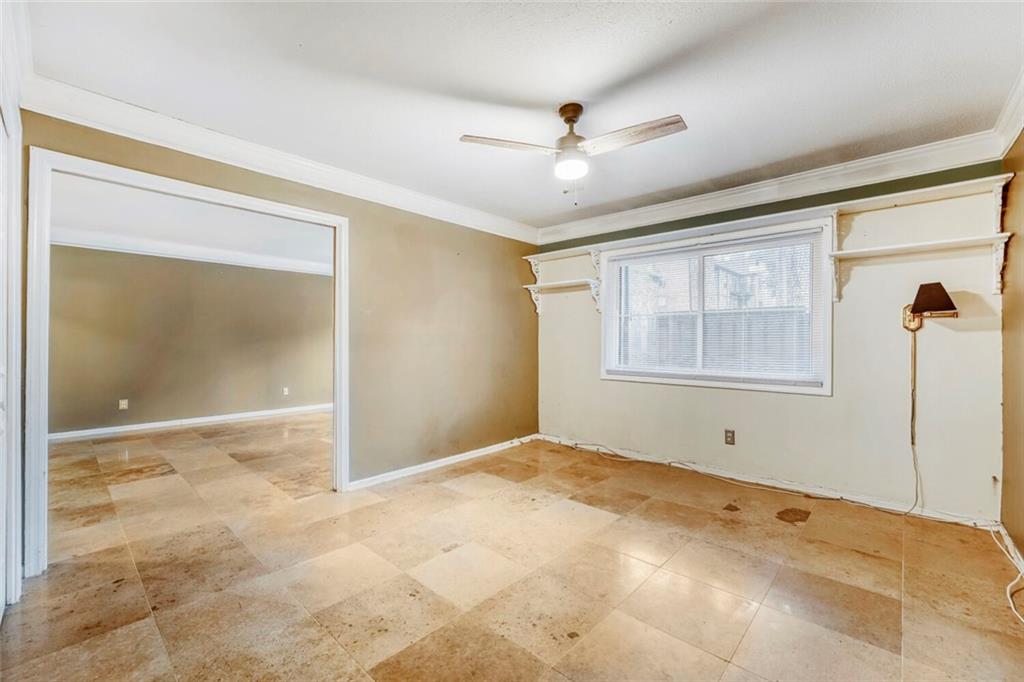 6851 Roswell Road, Unit M13 Atlanta, GA 30328 - Photo 7 of 28 a view of an empty room with a window