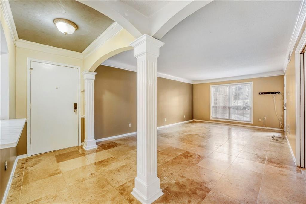 6851 Roswell Road, Unit M13 Atlanta, GA 30328 - Photo 9 of 28 a view of an empty room and window