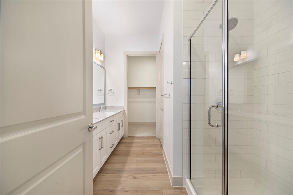 4700 West Spring Creek Parkway, Unit 9103 Plano, TX 75024 - Photo 24 of 40 a bathroom with a double vanity sink and a shower
