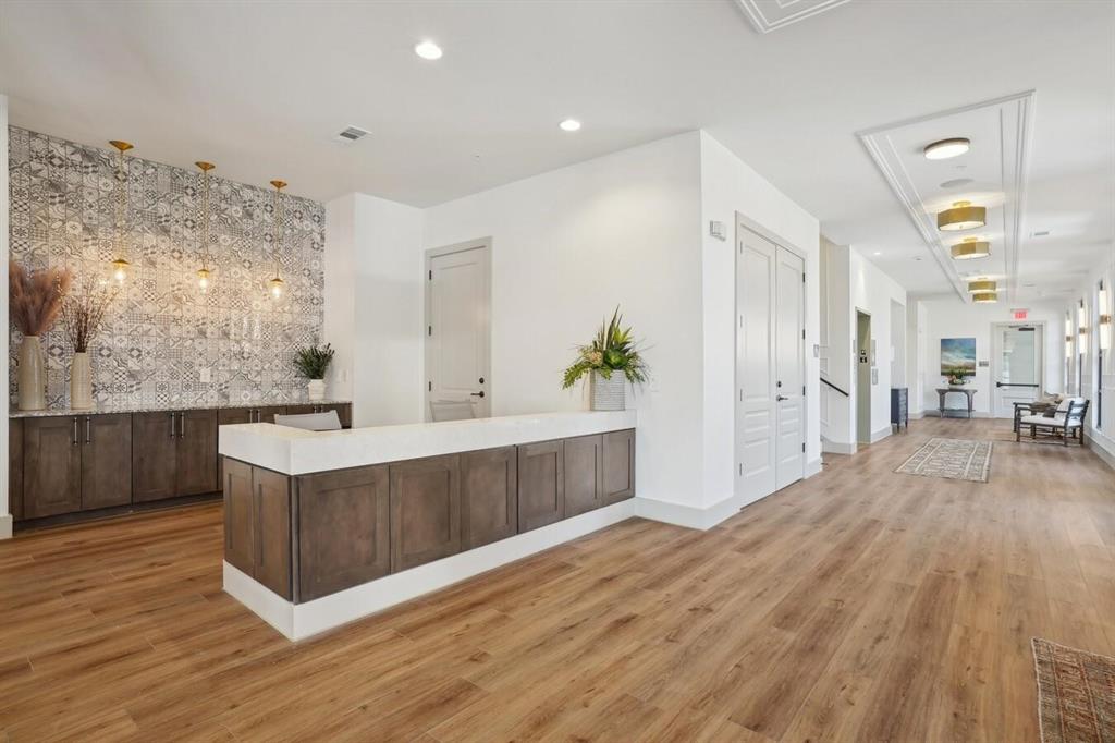 4700 West Spring Creek Parkway, Unit 9103 Plano, TX 75024 - Photo 30 of 40 a view of kitchen with sink and wooden floor