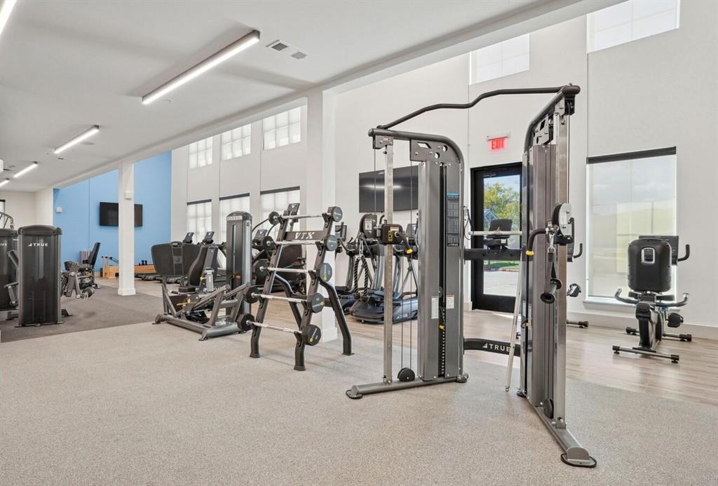 4700 West Spring Creek Parkway, Unit 9103 Plano, TX 75024 - Photo 34 of 40 a view of a room with gym equipment