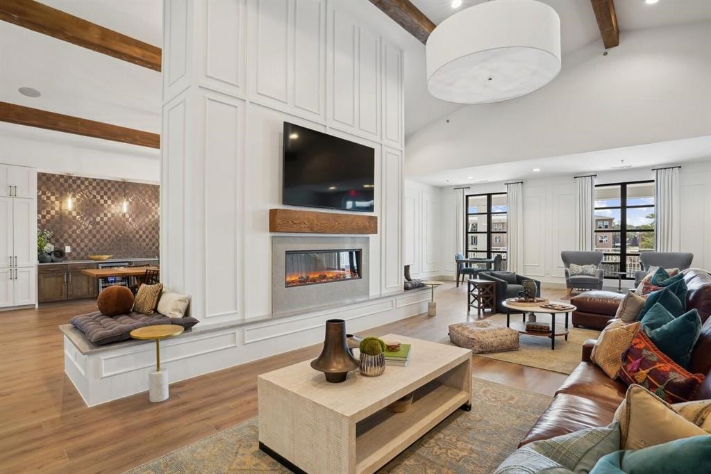 4700 West Spring Creek Parkway, Unit 9103 Plano, TX 75024 - Photo 35 of 40 a living room with furniture and a flat screen tv