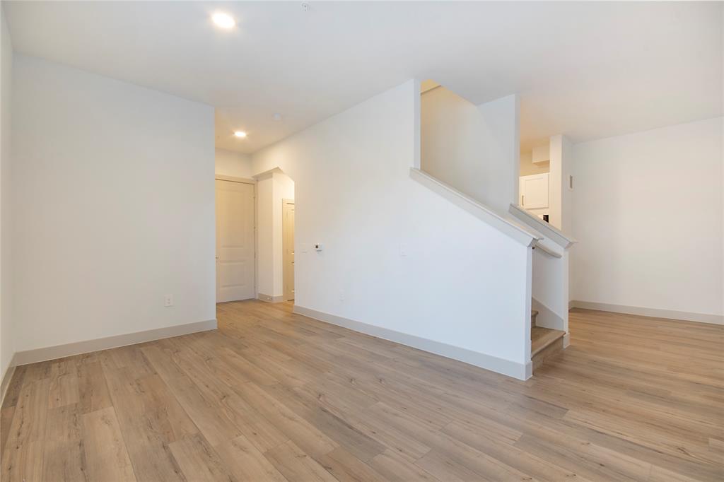 4700 West Spring Creek Parkway, Unit 9103 Plano, TX 75024 - Photo 10 of 40 a view of a room with wooden floor