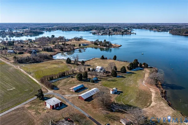 an aerial view of a house with outdoor space