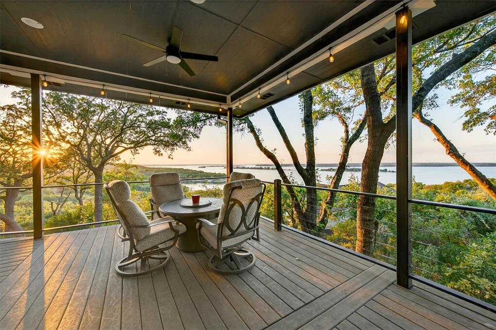 a view of a porch with furniture and wooden floor