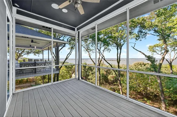 a view of balcony with wooden floor