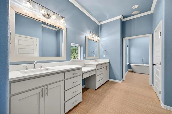 a spacious bathroom with a granite countertop sink mirror and