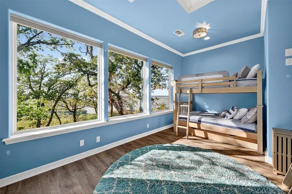 a living room with a bed and a window