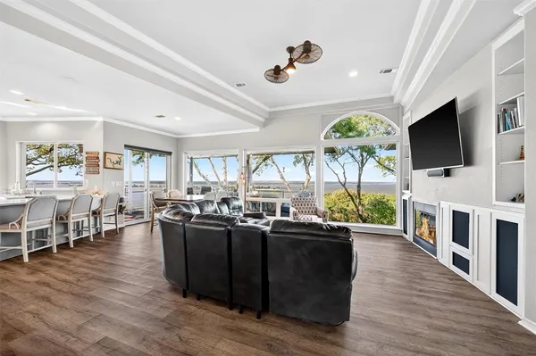 a living room with fireplace furniture and a flat screen tv