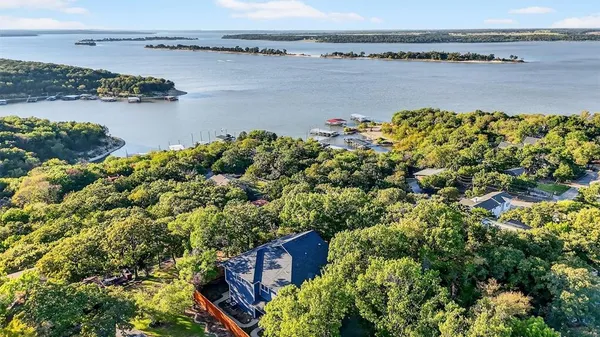 a view of a lake with a house and a ocean view