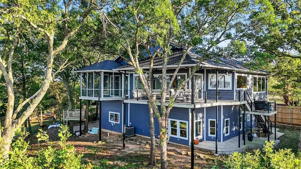 a front view of a house with yard porch and furniture