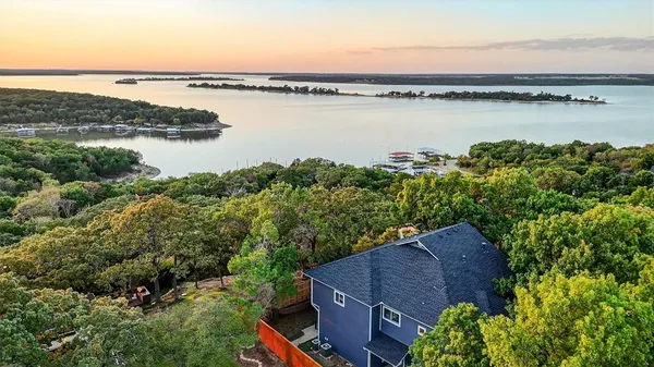 a view of a lake with a house in the background