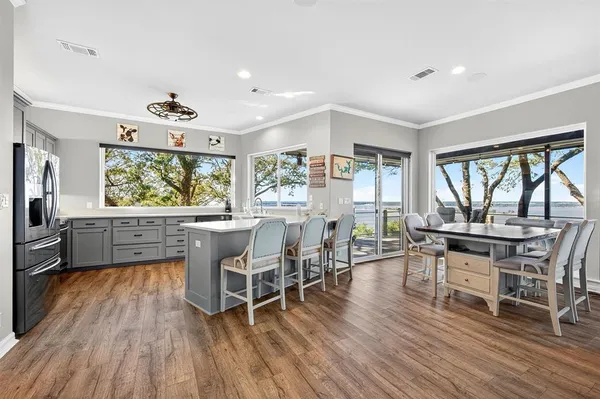 a view of a dining room with furniture window and wooden floor