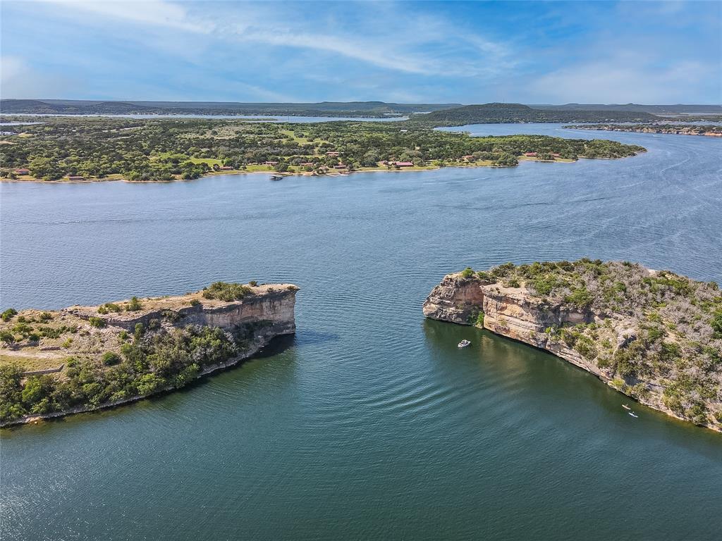 7036 Hells Gate Loop Strawn, TX 76475 - Photo 14 of 23 a view of a lake from a balcony