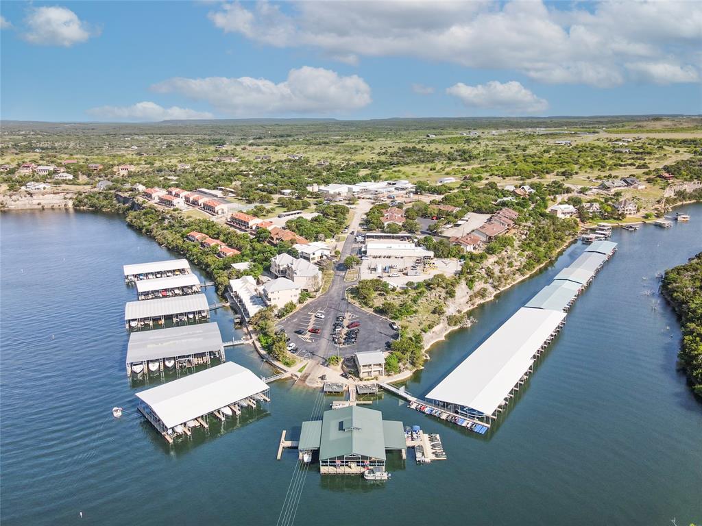 7036 Hells Gate Loop Strawn, TX 76475 - Photo 19 of 23 an aerial view of residential houses with outdoor space