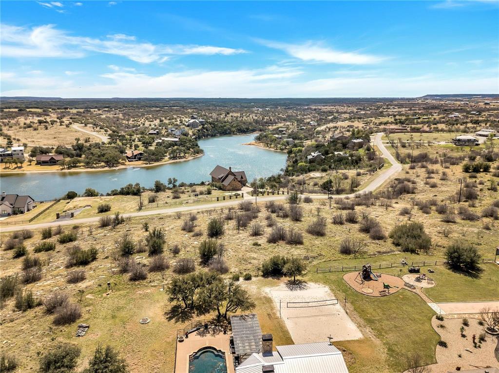 7036 Hells Gate Loop Strawn, TX 76475 - Photo 3 of 23 an aerial view of residential building with parking space