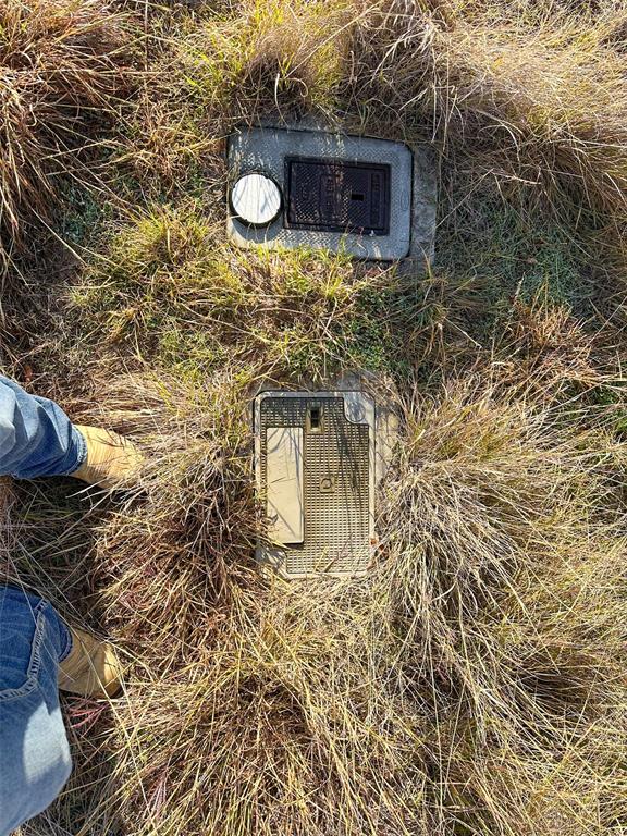 7036 Hells Gate Loop Strawn, TX 76475 - Photo 8 of 23 a bathroom with a sink and a mirror