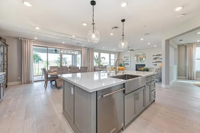 a view of a dining room with furniture large windows and wooden floor