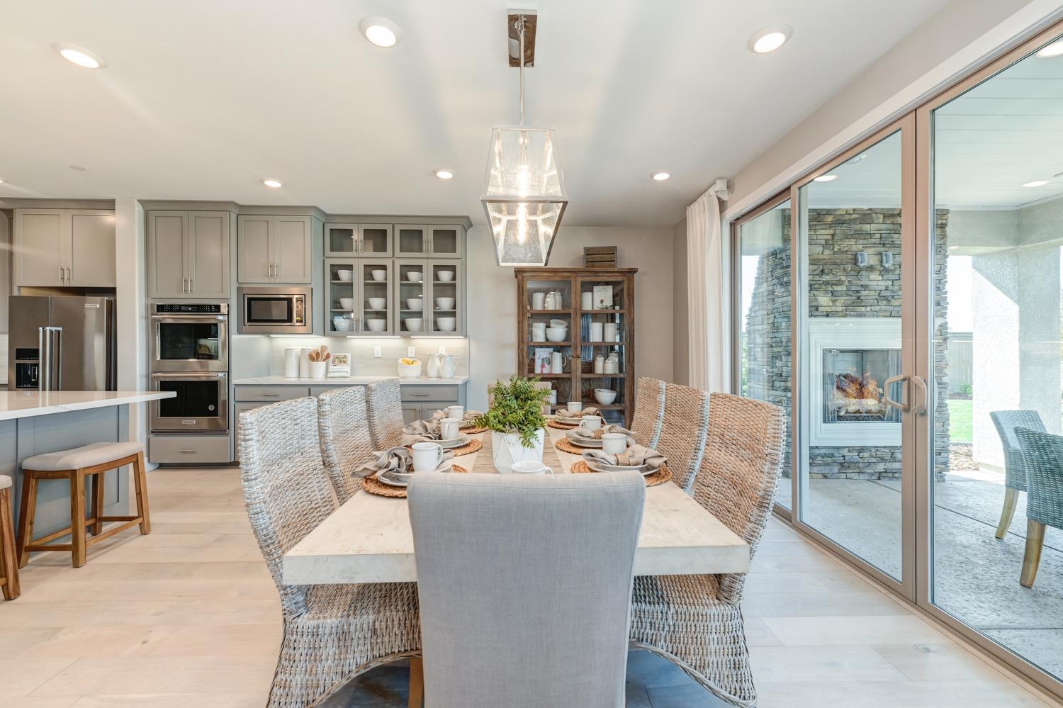2009 Arbor Rdg Drive Roseville, CA 95747 - Photo 17 of 70 a view of a dining room with furniture large windows and wooden floor