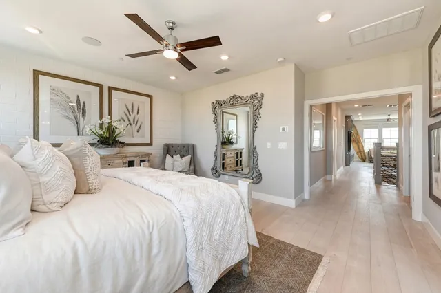 a bed room with a bed and a chandelier