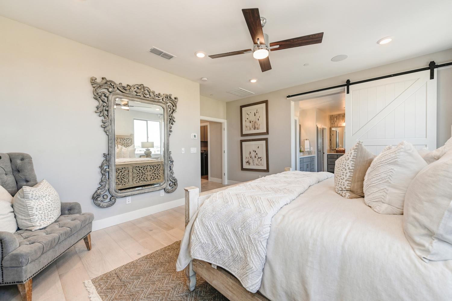 2009 Arbor Rdg Drive Roseville, CA 95747 - Photo 29 of 70 a spacious bedroom with a bed and ceiling fan
