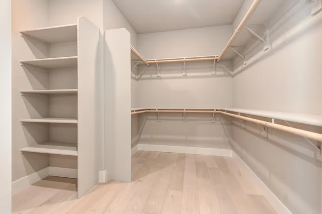 a view of living room filled with furniture and a chandelier