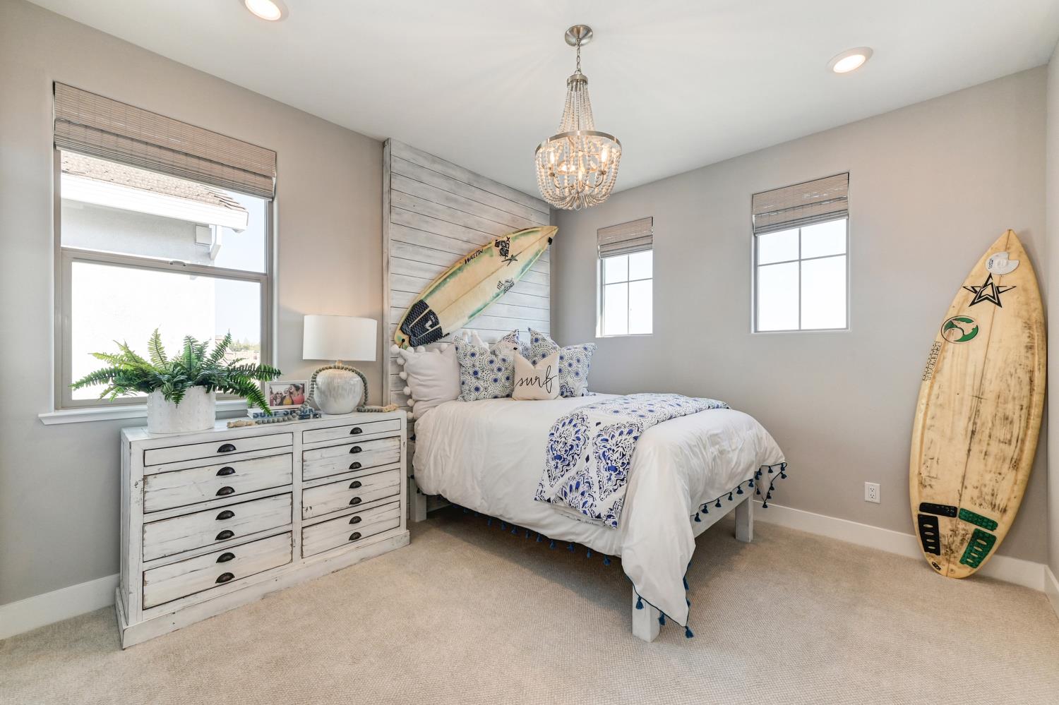 2009 Arbor Rdg Drive Roseville, CA 95747 - Photo 36 of 70 a bed room with a bed and a chandelier