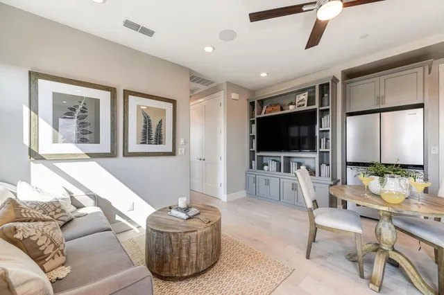 a front view of a house with a yard porch and outdoor seating