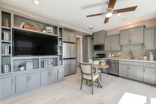 a view of a backyard with sitting area