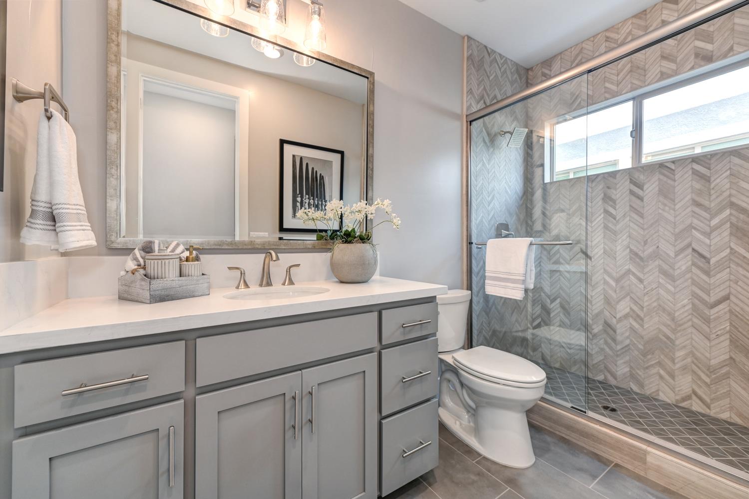 2009 Arbor Rdg Drive Roseville, CA 95747 - Photo 10 of 70 a bathroom with a toilet sink vanity and mirror