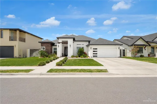 a front view of house with yard and green space
