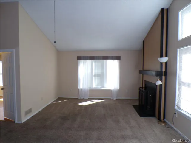 a view of livingroom with furniture and a window