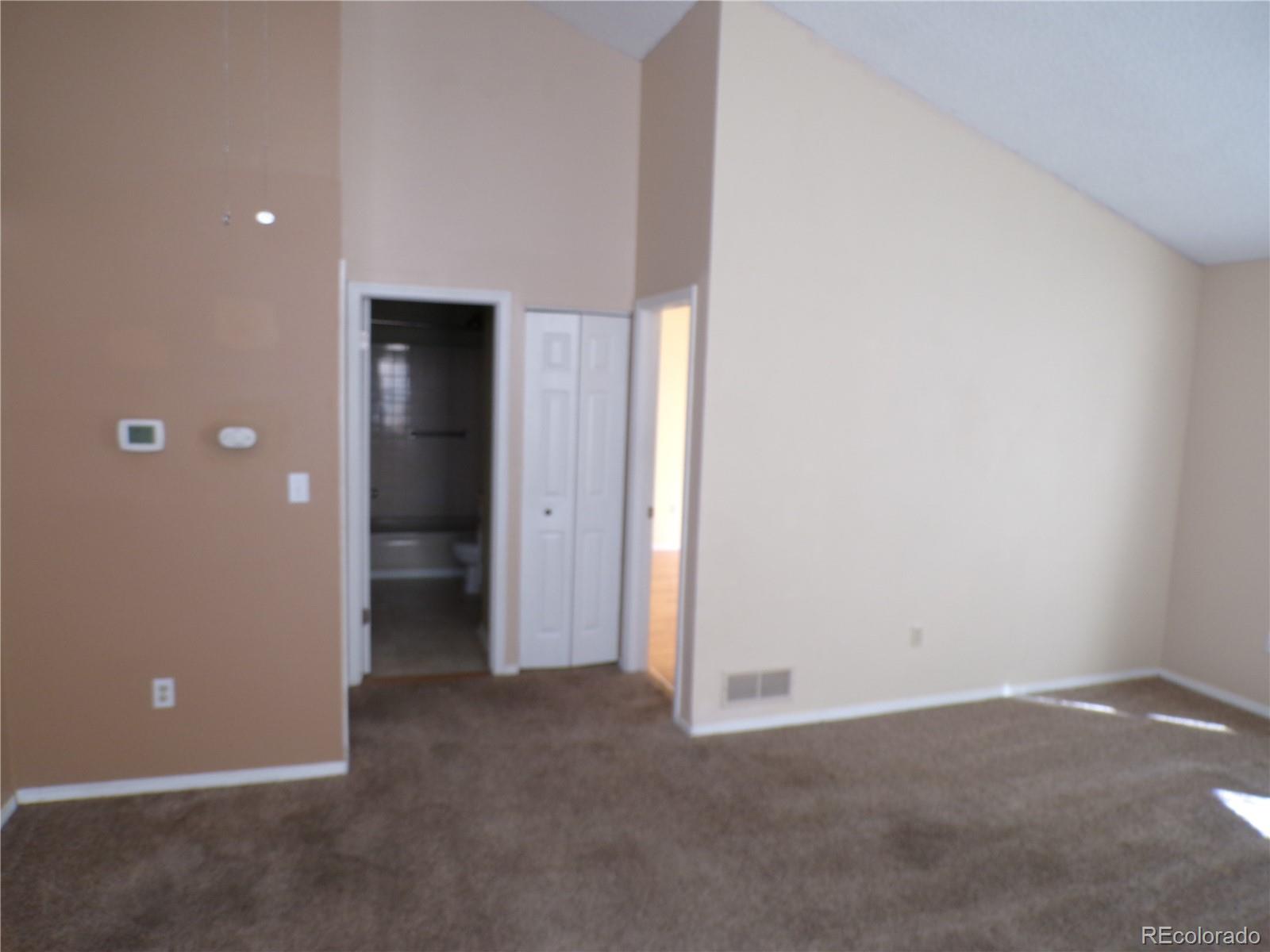 9644 West Chatfield Avenue, Unit A Littleton, CO 80128 - Photo 5 of 11 an empty room with closet area