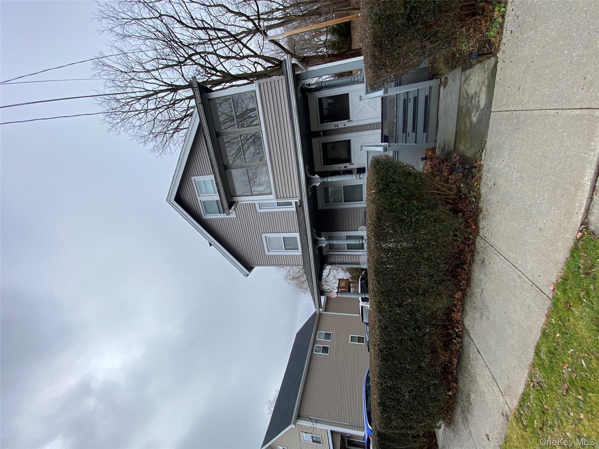21 Lincoln Avenue, Unit 2 Poughkeepsie, NY 12601 - Photo 12 of 18 a front view of a house with garden