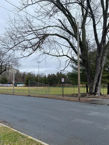a view of outdoor space with playground and green space