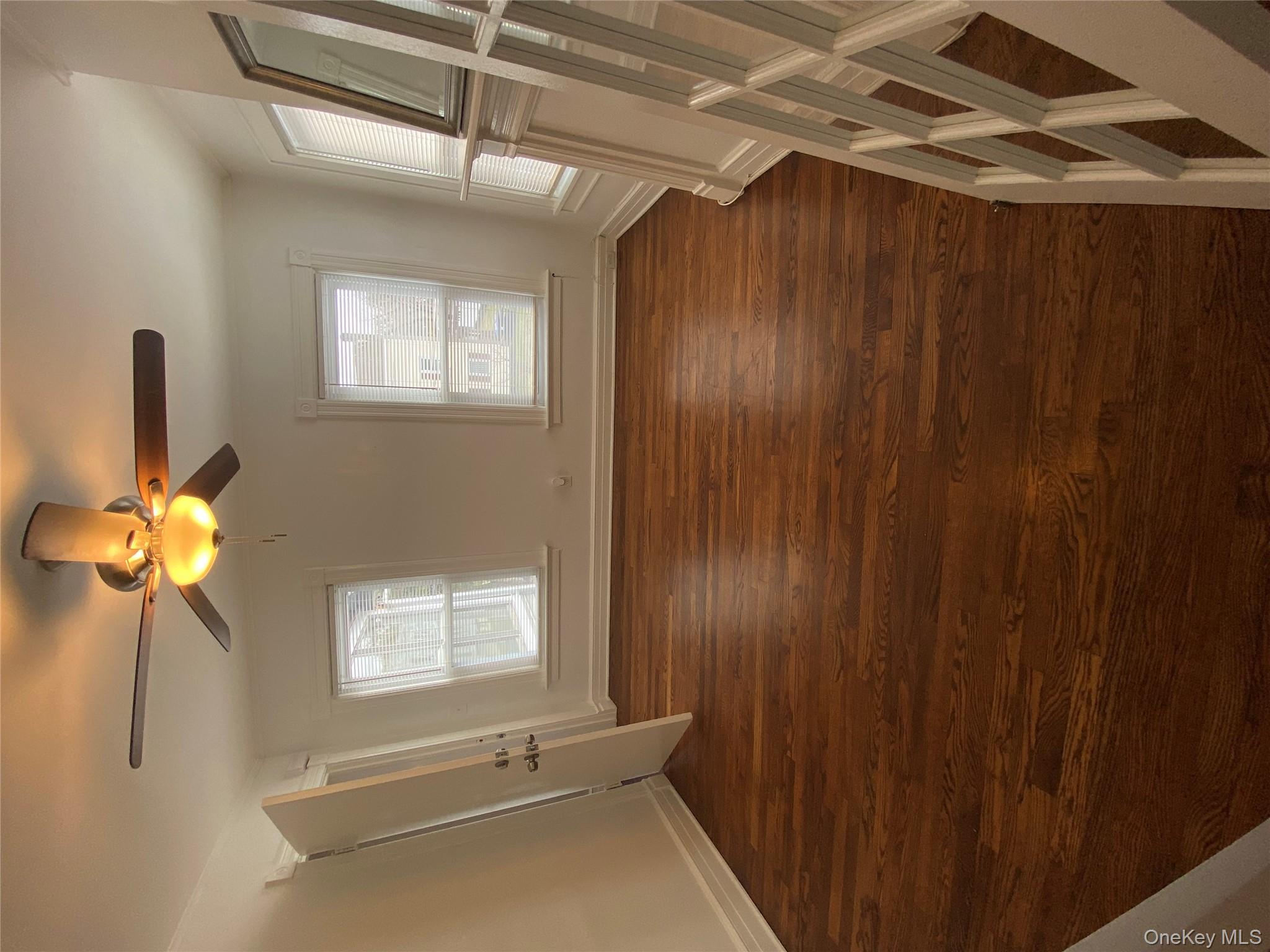 21 Lincoln Avenue, Unit 2 Poughkeepsie, NY 12601 - Photo 4 of 18 a view of an empty room with window and hardwood floor