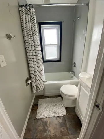 a bathroom with a toilet a sink and a bathtub