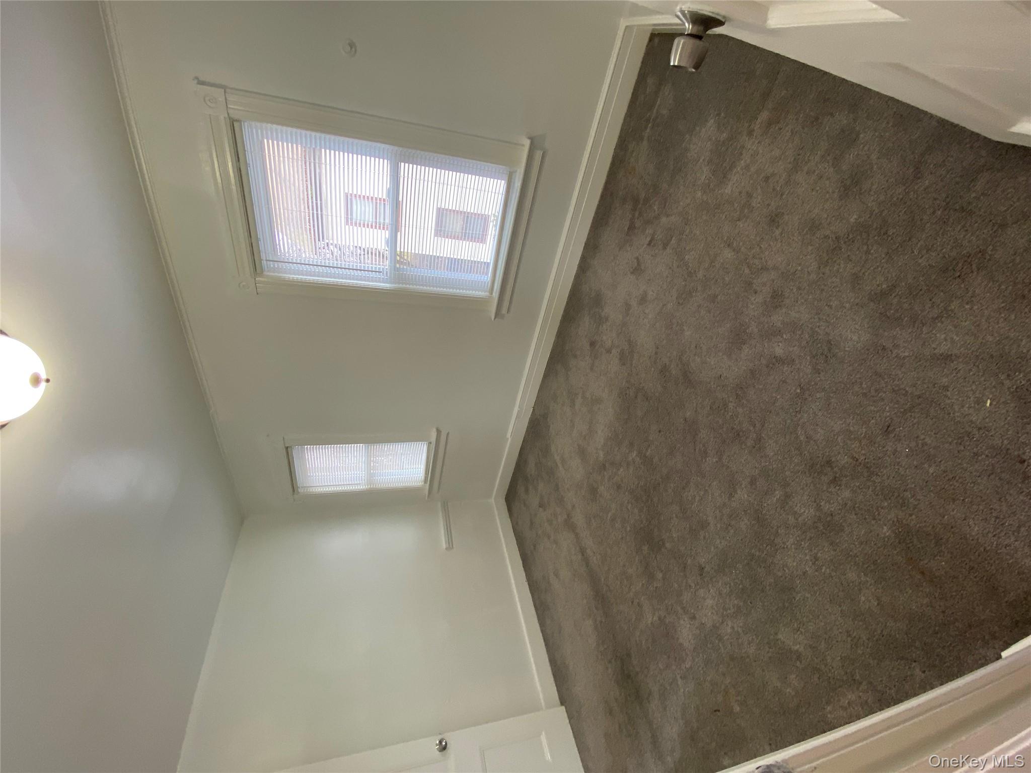 21 Lincoln Avenue, Unit 2 Poughkeepsie, NY 12601 - Photo 9 of 18 an empty room with a window