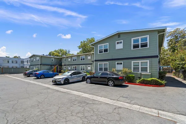 a view of street with parked cars