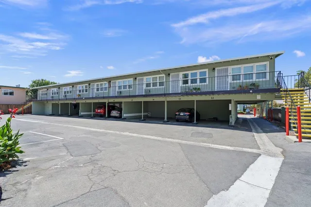 a view of a building with a yard