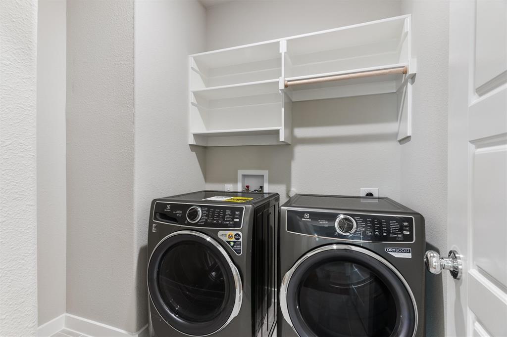 2010 Sandpiper Way Princeton, TX 75407 - Photo 22 of 40 a utility room with dryer washer and a view of storage