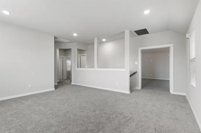 an empty room with a empty space and window