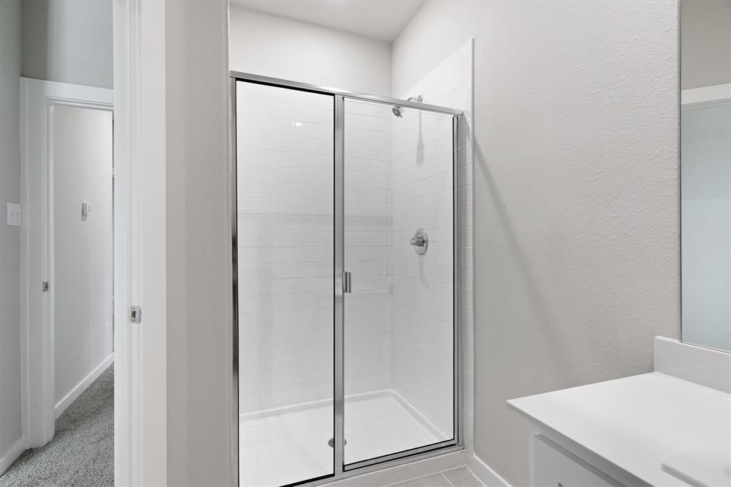 2010 Sandpiper Way Princeton, TX 75407 - Photo 34 of 40 a bathroom with a shower and a sink