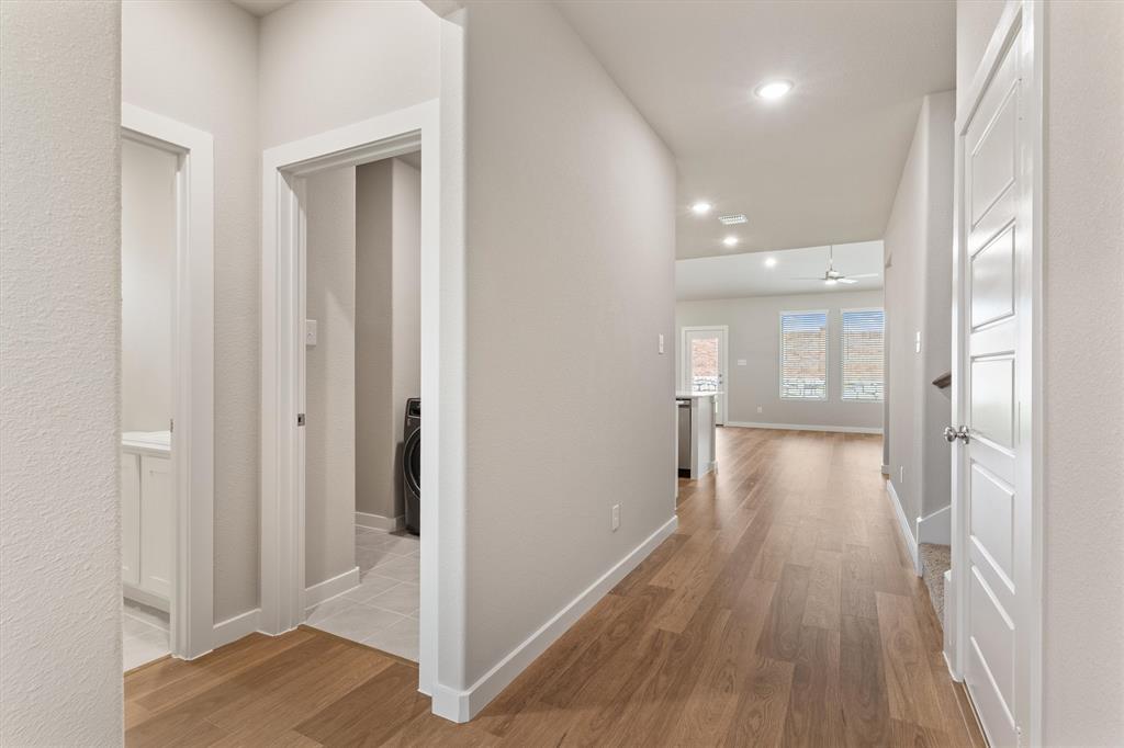 2010 Sandpiper Way Princeton, TX 75407 - Photo 4 of 40 a view of a hallway with wooden floor