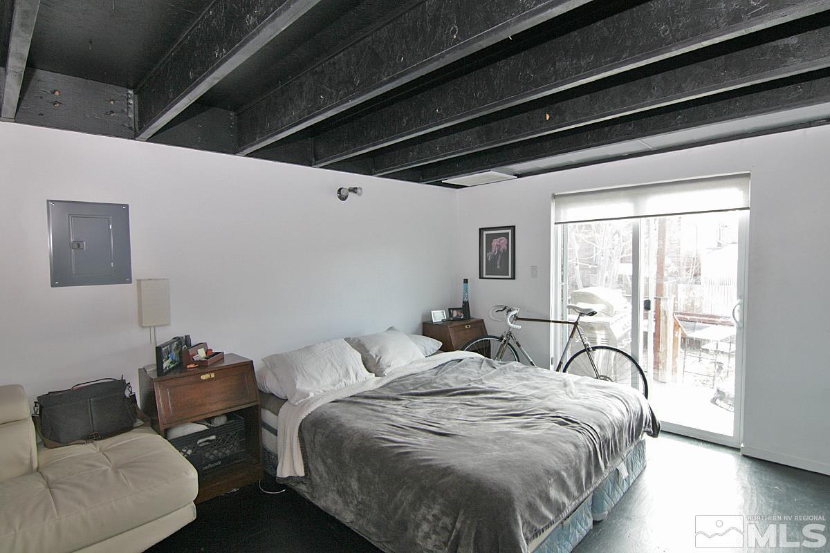 342 Stewart Street Reno, NV 89502 - Photo 6 of 11 a bedroom with bed and a large window